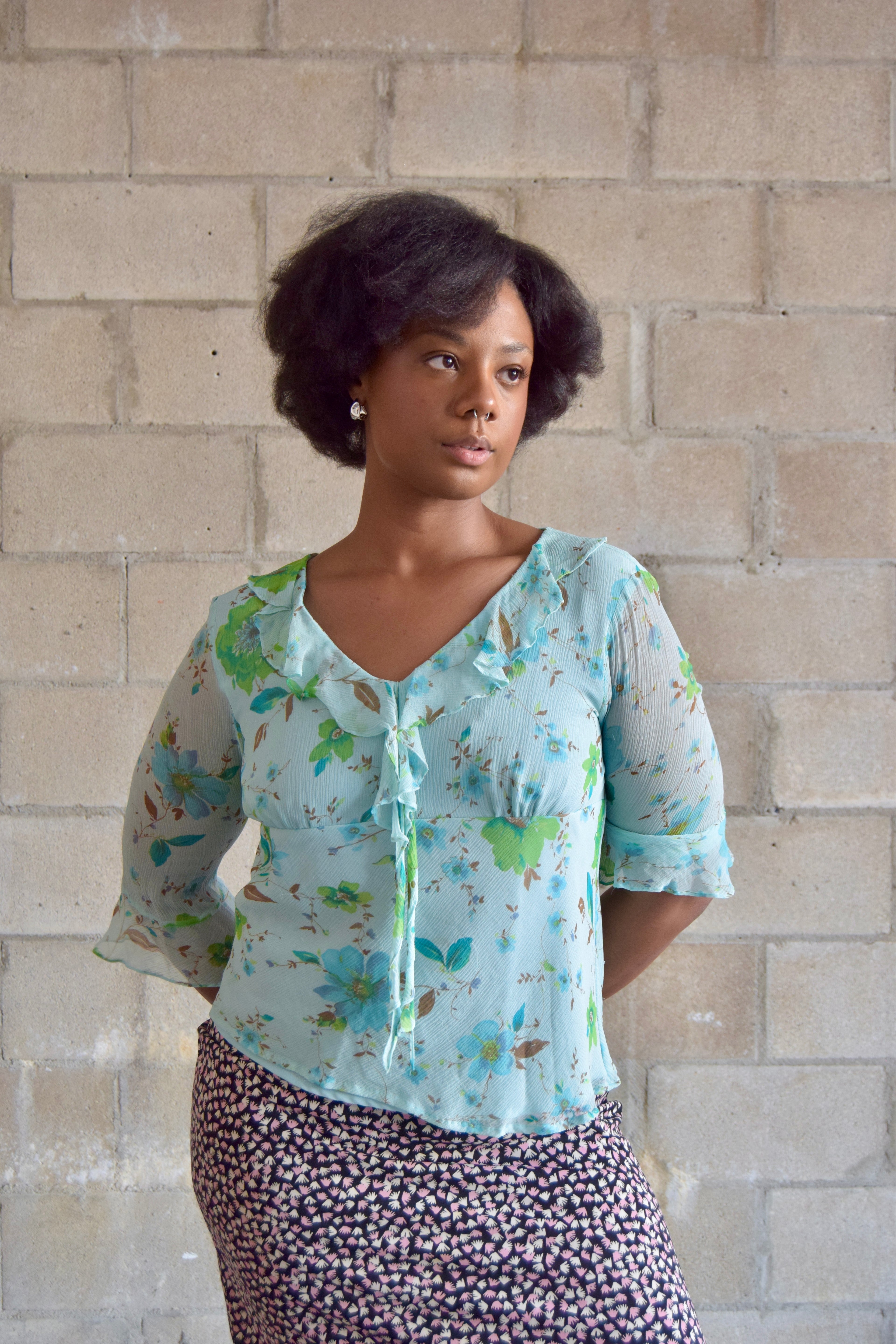 NYC DESIGN CO BABY BLUE FLORAL SILK V NECK TOP WITH RUFFLE TRIM