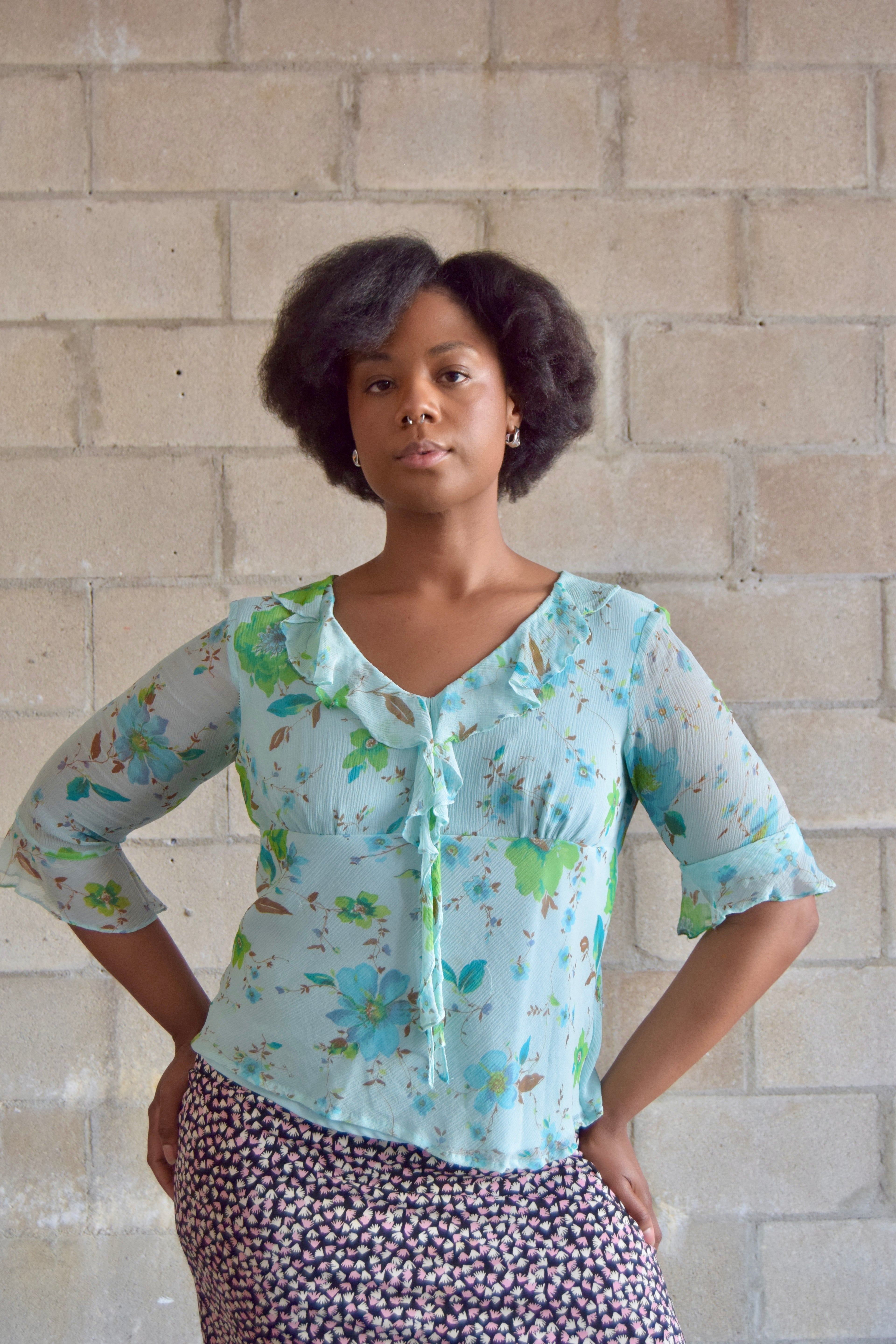 NYC DESIGN CO BABY BLUE FLORAL SILK V NECK TOP WITH RUFFLE TRIM