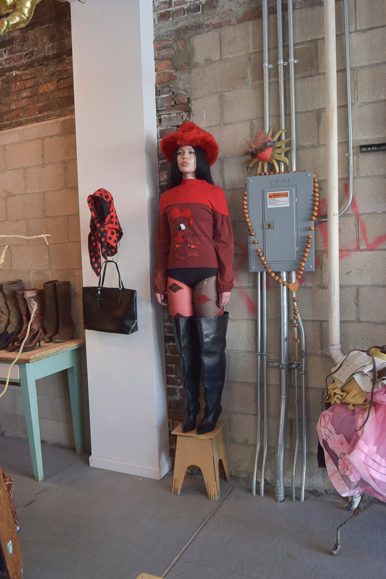 AVISPADA TWO TONED RED MOCK NECK SWEATER WITH STATEMENT EMBROIDERY