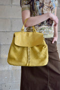 VIOLA CASTELLANI YELLOW WOVEN BACKPACK WITH BRASS STUD DETAILING