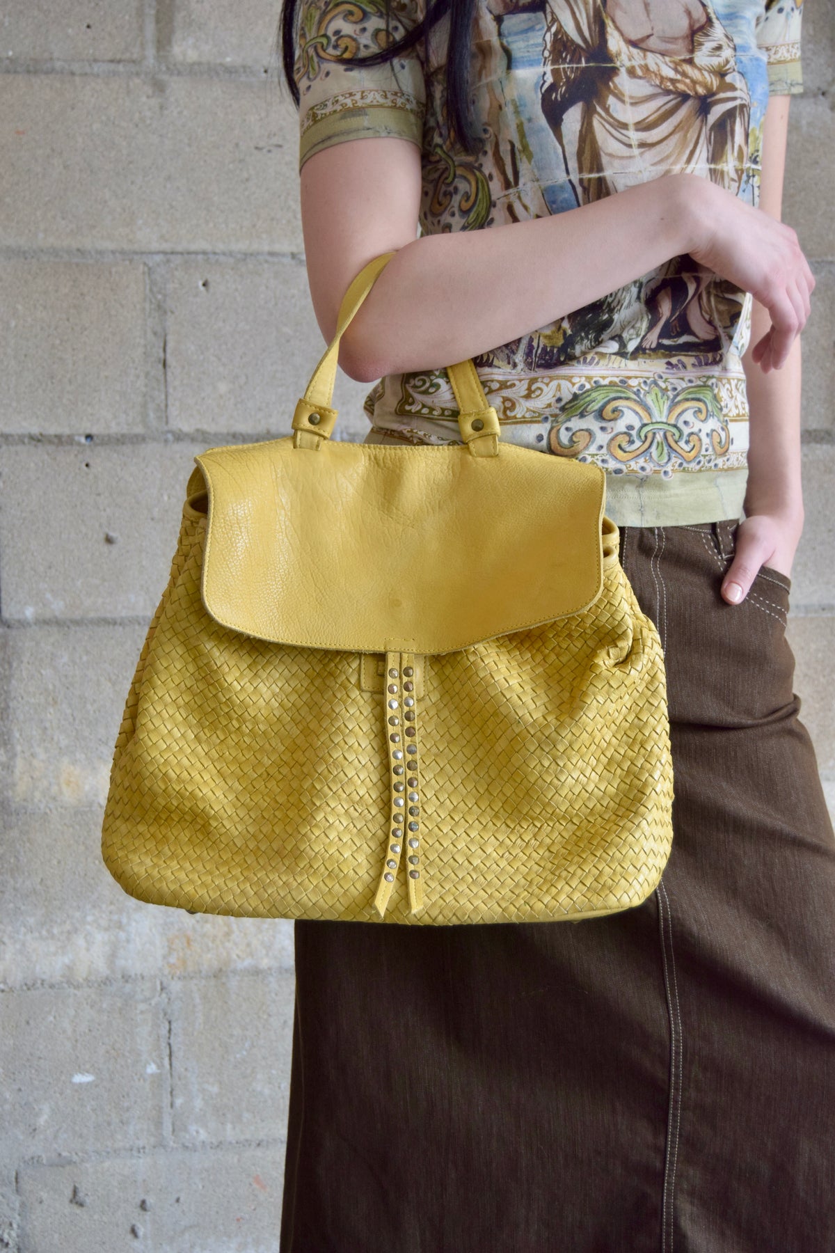 VIOLA CASTELLANI YELLOW WOVEN BACKPACK WITH BRASS STUD DETAILING