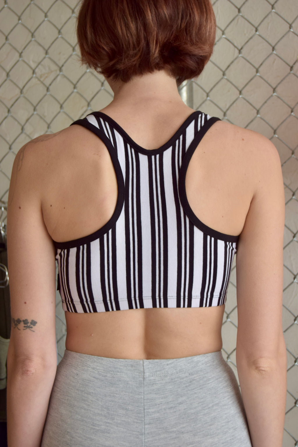 MARIKA BLACK AND WHITE PINSTRIPE SPORTS BRA WITH BLACK TRIM
