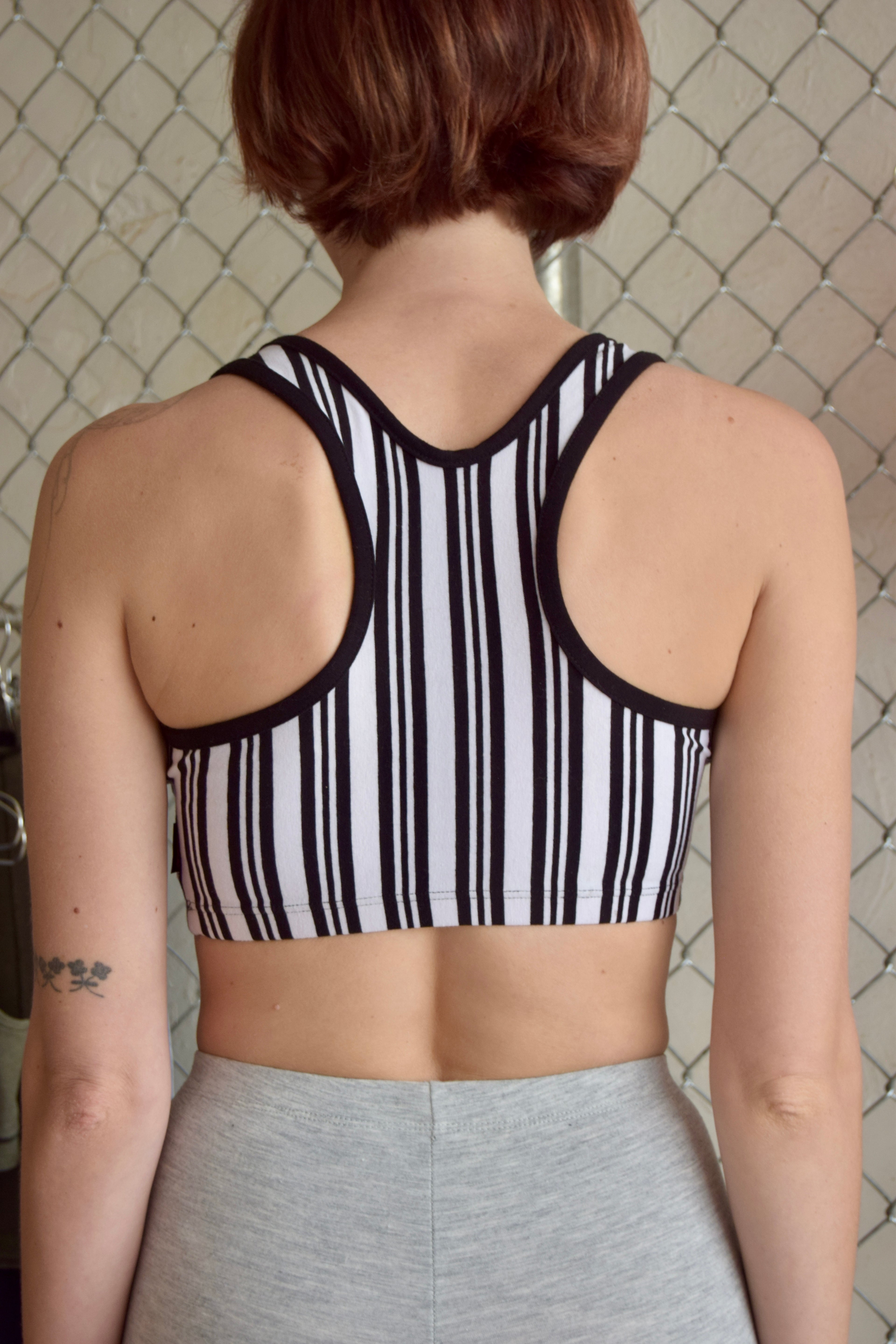 MARIKA BLACK AND WHITE PINSTRIPE SPORTS BRA WITH BLACK TRIM