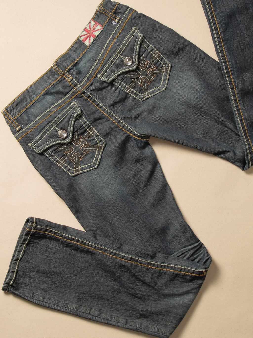 MACHINE DISTRESSED LOW RISE DARK WASH JEANS