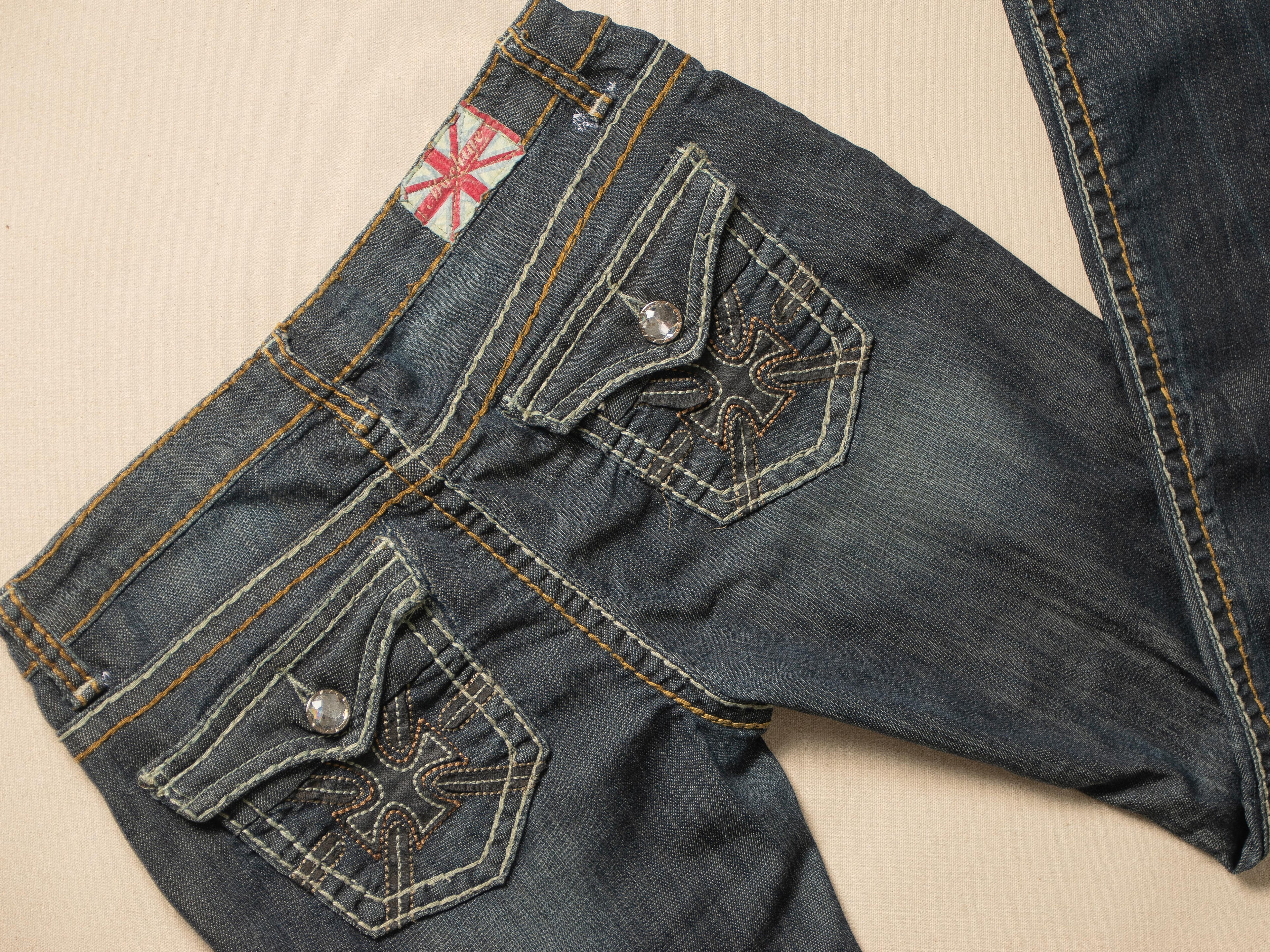 MACHINE DISTRESSED LOW RISE DARK WASH JEANS