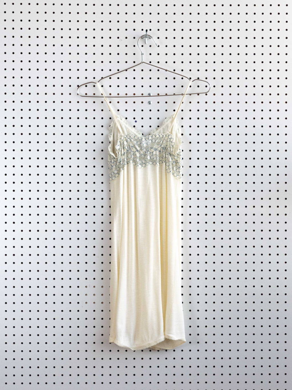 CRÈME BABYDOLL DRESS WITH BLUE LACE DETAIL