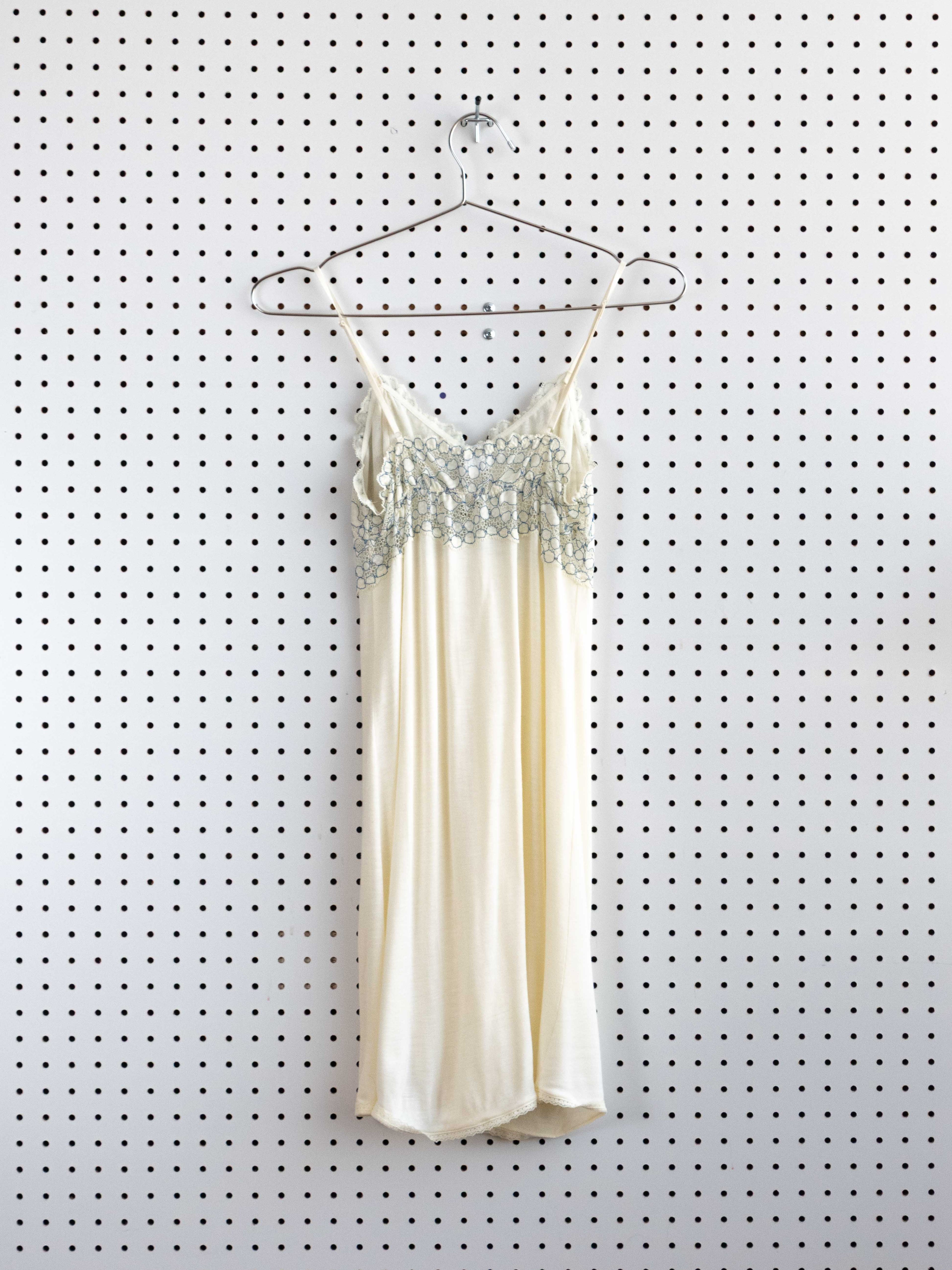 CRÈME BABYDOLL DRESS WITH BLUE LACE DETAIL